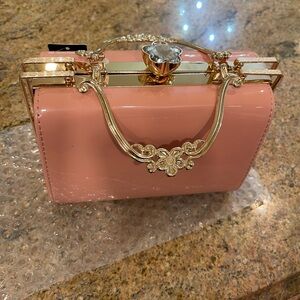 New w tags Elegant Pink Handbag with Gold Accents